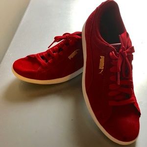 Red suede Puma sneakers